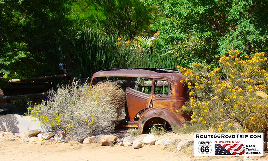 Rusted car resting in the desert near Hackberry, Arizona on Route 66