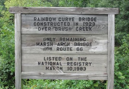 Sign at the Rainbow Curve Bridge, constructed in 1923 over Brush Creek ... the only remaining Marsh Arch Bridge on Route 66