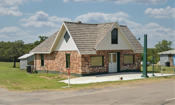 The historic Threatt Filling Station on Route 66 near Luther, Oklahoma, showing restoration progress as of 2023