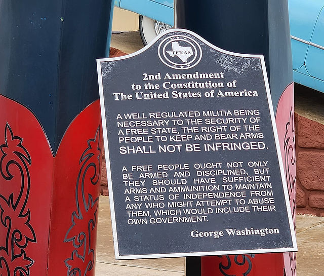 The plaque under the 2nd Amendment Cowboy at the Cadillac RV Park