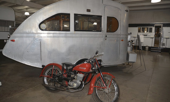 Vintage camper and motorcycle at the Jack Sisemore RV Museum in Amarillo, Texas